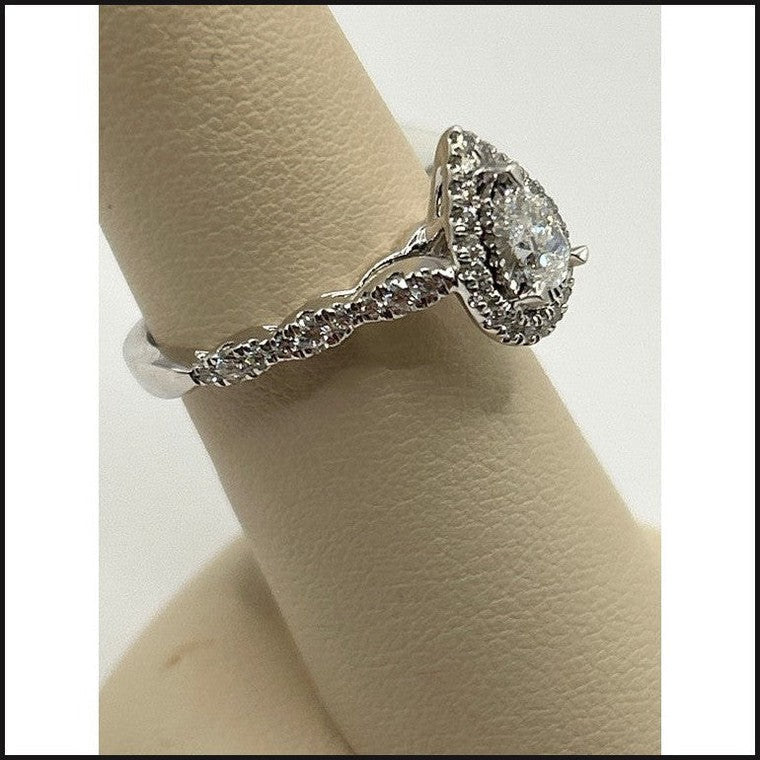 14kw 5/8ctw pear shape diamond halo engagement ring