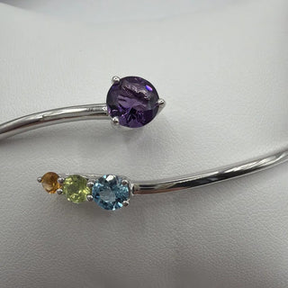 Sterling silver bypass bangle with amethyst, blue topaz, peridot and citrine