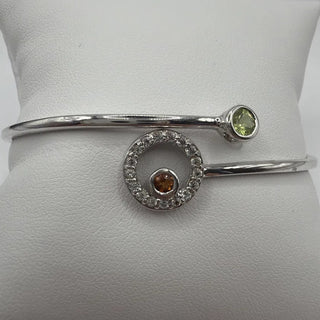 Sterling silver bypass bangle with peridot, citrine and white topaz circle