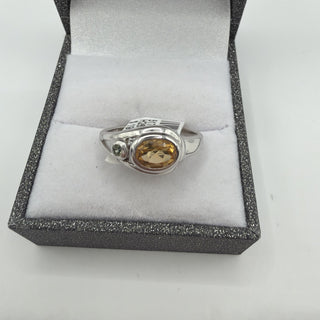 Sterling silver oval golden citrine ring with green accent stone