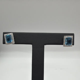 Sterling silver emerald-cut blue topaz halo stud earrings with white topaz