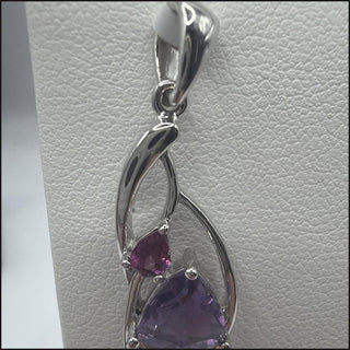 Sterling silver trillion amethyst crossover pendant with pink accent stone