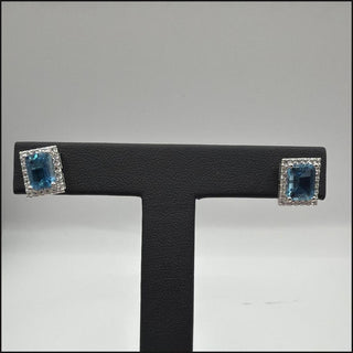Sterling silver emerald-cut blue topaz halo stud earrings with white topaz