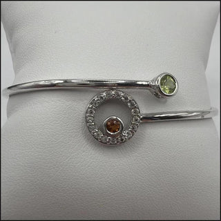 Sterling silver bypass bangle with peridot, citrine and white topaz circle