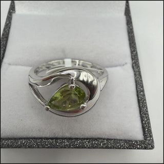 Sterling silver pear-cut peridot ring with swirl design